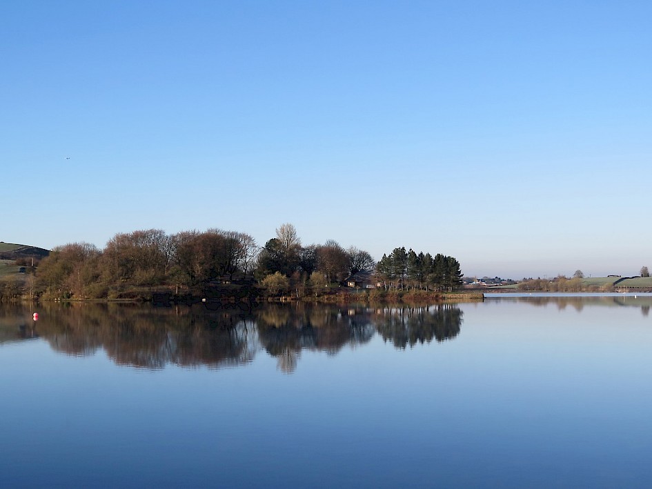 View across the lake to the Pavilion Wood